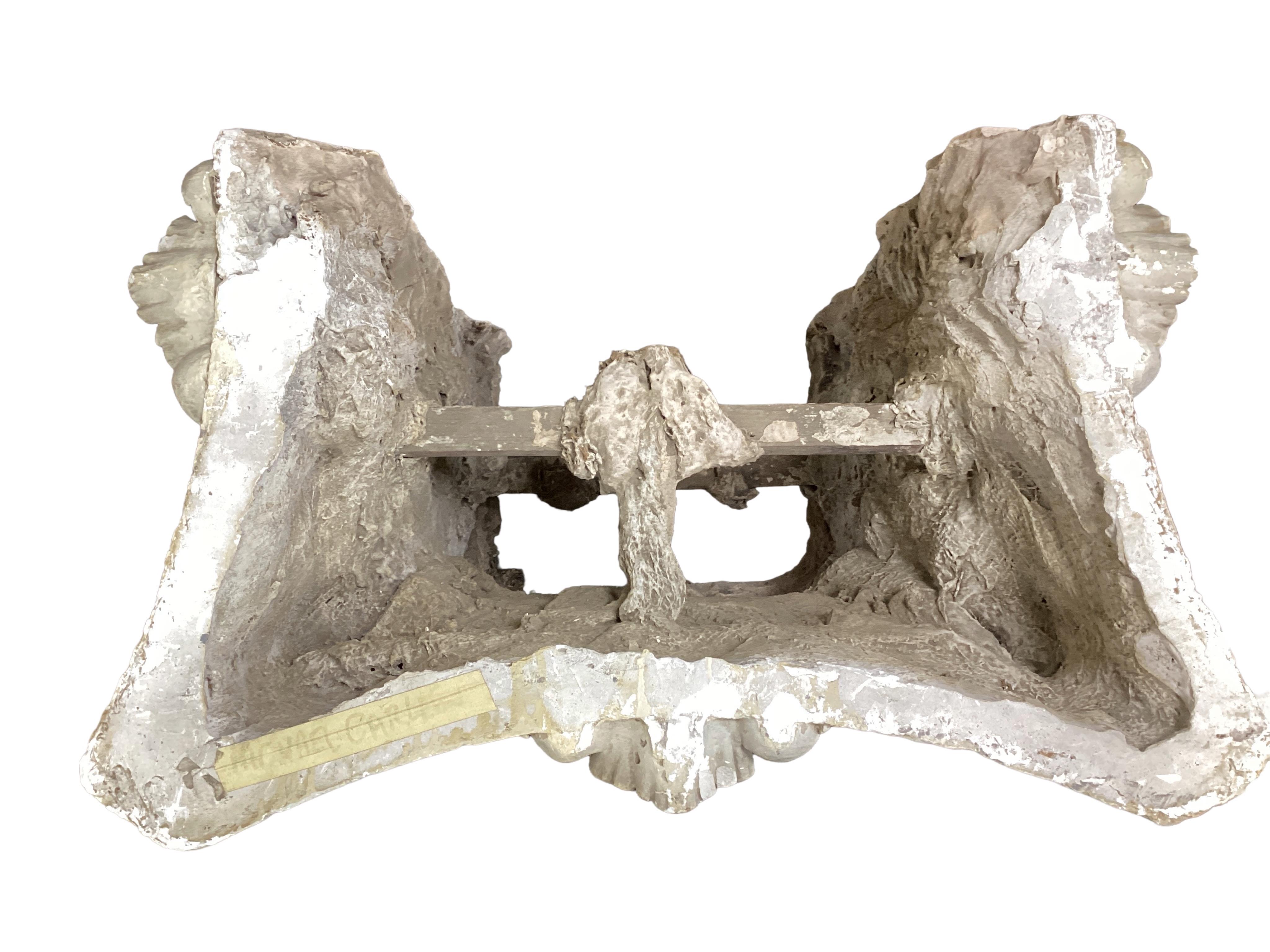 A marble topped white painted composition Ionic capital